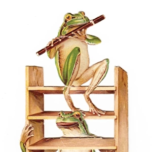 Two frogs with flute and ladder on a New Year card