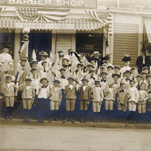 Group of adults and children with flags, USA