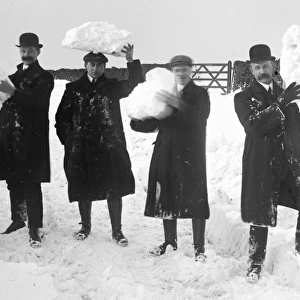 Group of men holding snow