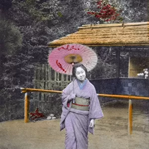 Japan - Geisha Girl walking in garden - bizarre expression