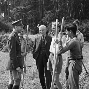 King George VI talking to wartime farm helpers