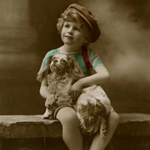 Little boy with spaniel on a birthday postcard