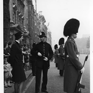Male and female police officers in a London street