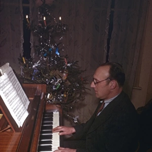 Man playing piano at Christmas