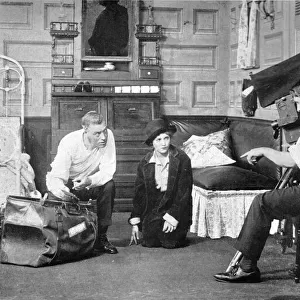 Mary Pickford making a picture (1919). To the left of Pickford with a bag is the director Sidney Scott. Kneeling on the right by the cameraman is Marys brother Jack Pickford Date: 1919