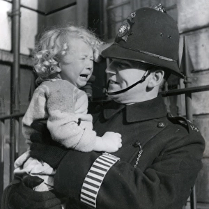 Metropolitan Police officer and crying child