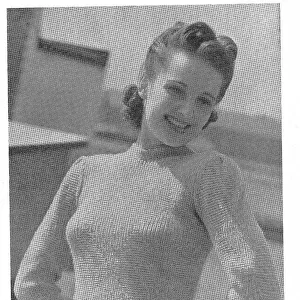 Model wearing a tight knitted sweater in a diamond pattern of rib and garter stitch. Date: 1940