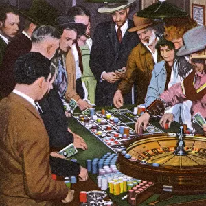 People with roulette wheel, Nevada, USA
