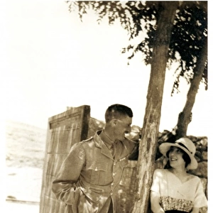 RAF officer and wife under shady tree, Middle East