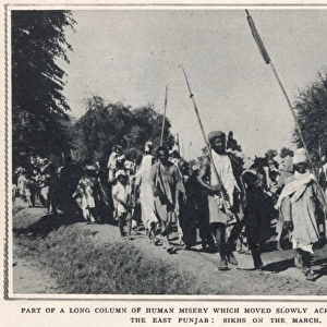 Refugee Sikhs march toward the East Punjab