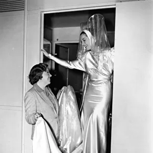 Rosalind Russell and Dolly Tree on the set of Manproof