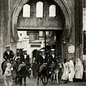 Royal Navy sailors riding on donkeys, Tangier, Morocco