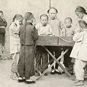 Schoolchildren listening to recording, China, East Asia
