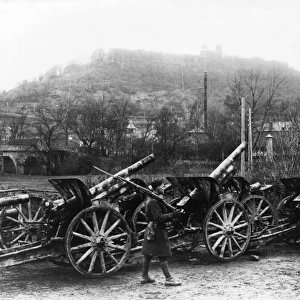 Soldier guarding captured guns, Montmedy, France