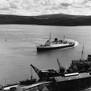 A striking view of steamships in Fishguard Harbour, Pembrokeshire, Wales. Date: 1950s