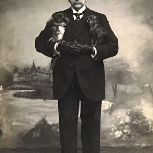 Studio portrait, man with two Pekingese dogs