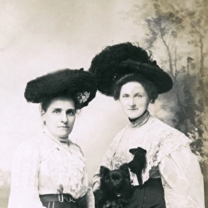 Studio portrait, two women with a small dog