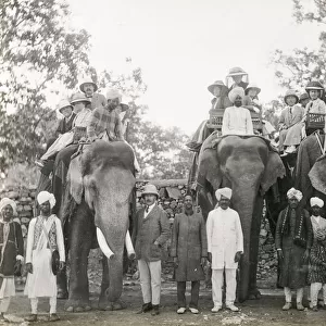 Travellers riding elephants in India, c. 1900