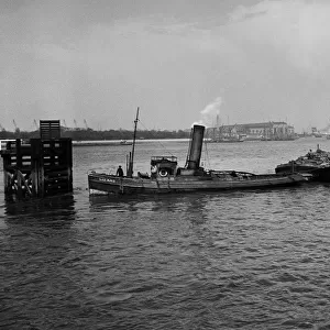 The tug Lizard on the River Thames, Woolwich, SE London