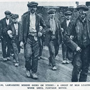 Typical Lancashire miners going on strike: A group of men leaving work until further