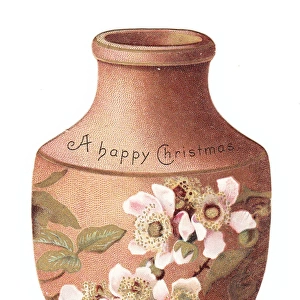 Vase decorated with flowers on a cutout Christmas card