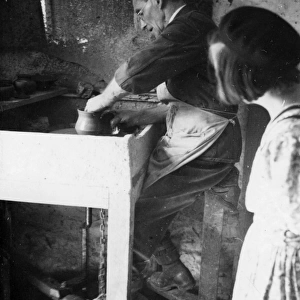 William Fishley Holland at work