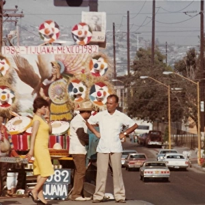 Woman and two men standing on the float above the street