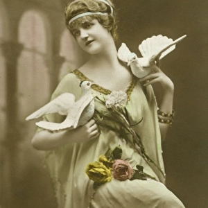 Woman posing with doves and flowers