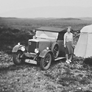 Woman with tent and car, Isle of Skye, Scotland