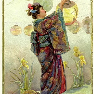 Woman in traditional dress lighting Japanese lanterns