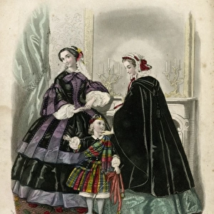 Two women and a child in the latest French fashions