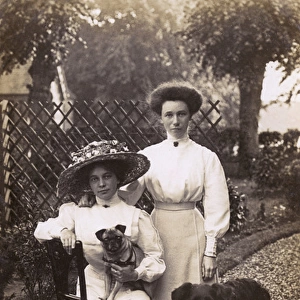 Women with two dogs
