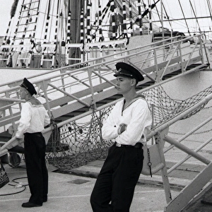 Two young Russian sailors on the deck of a ship