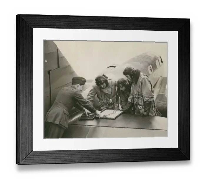 Framed Print : An instructor gives last-minute instructions to pupils Framed Print : An instructor gives last-minute instructions to pupils
