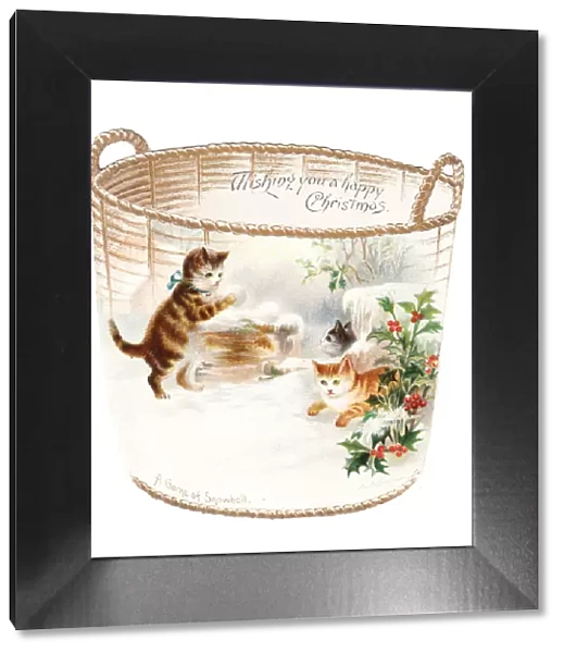 Three kittens snowballing on a cutout Christmas card