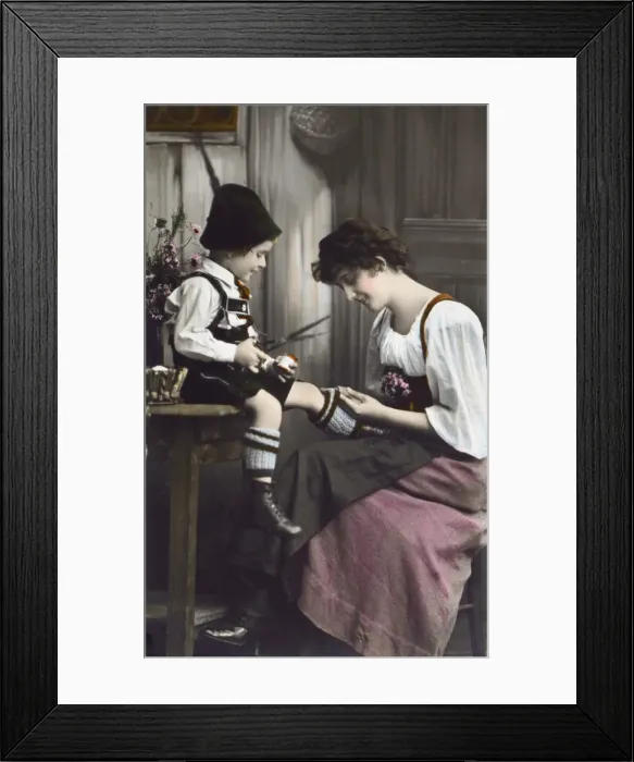 Framed Print : German Bavarian Mother mends her young sons sock Framed Print : German Bavarian Mother mends her young sons sock