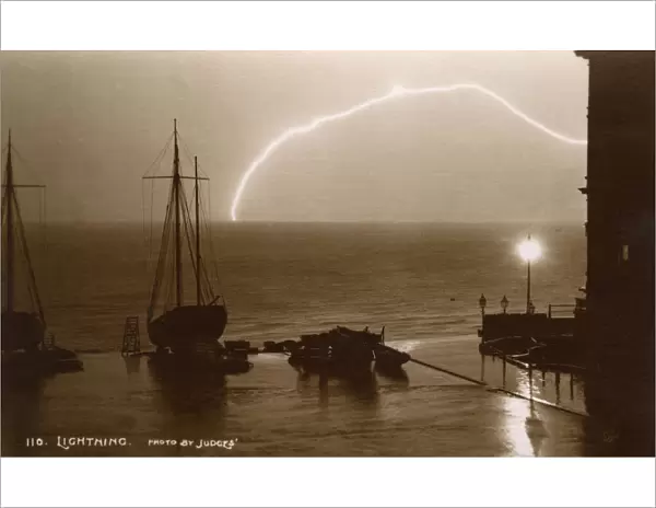 Hastings, Sussex - Lightning over the sea from the beach