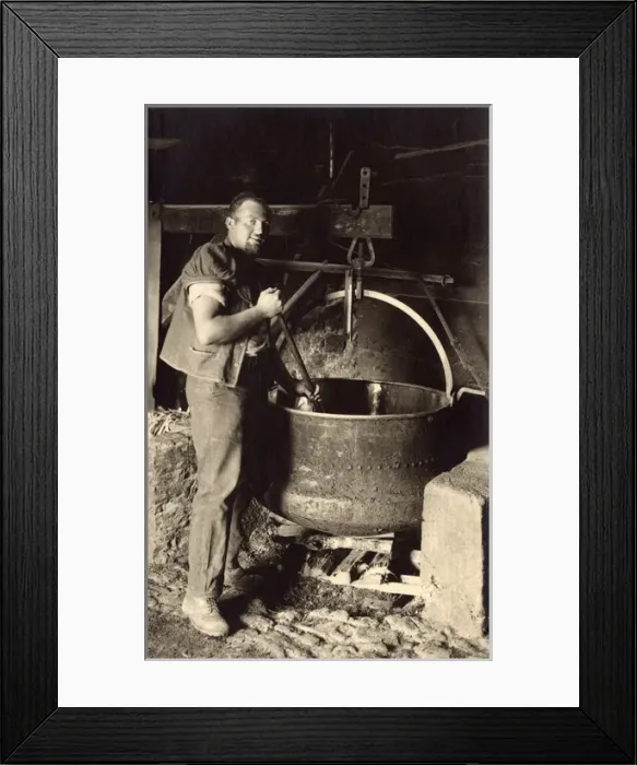 Framed Print : Swiss Cheesemaker stiring a large vat Framed Print : Swiss Cheesemaker stiring a large vat