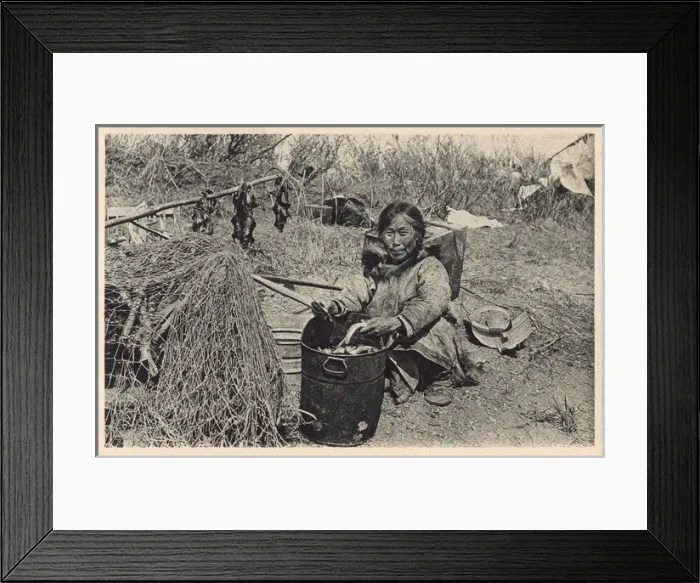 Framed Print : Inuit woman preparing fish and water rats - Alaska, USA
