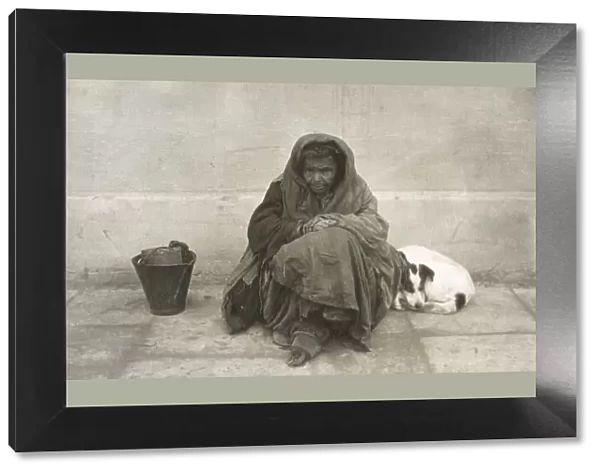 Poor Macedonian Beggar Woman and her dog