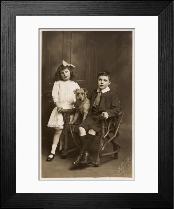 Framed Print : A Brother and Sister posing with their pet dog Framed Print : A Brother and Sister posing with their pet dog
