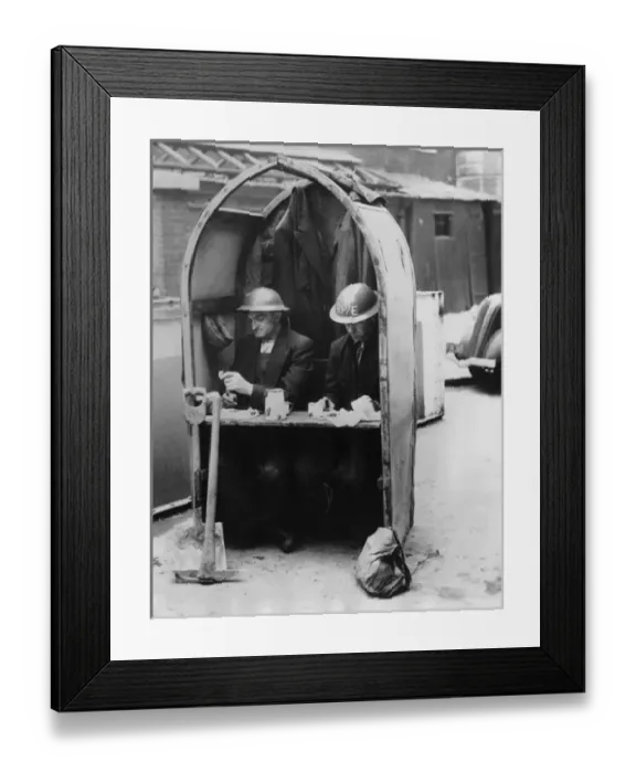 Framed Print : A Cosy Diner - Workmen have lunch amid the air raids Framed Print : A Cosy Diner - Workmen have lunch amid the air raids