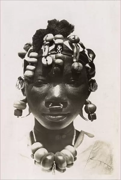 Girl from Mali with wonderful beads and headdress