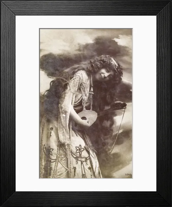 Framed Print : Unusual woman playing a small stringed instrument Framed Print : Unusual woman playing a small stringed instrument