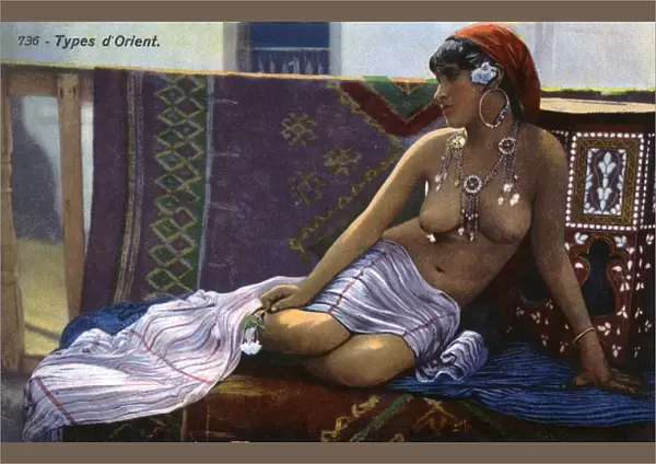 Oriental beauty reclining on a divan