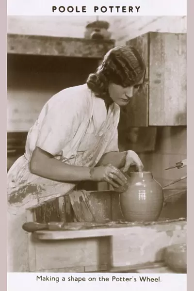 Poole Pottery - Shaping a pot on the potters wheel