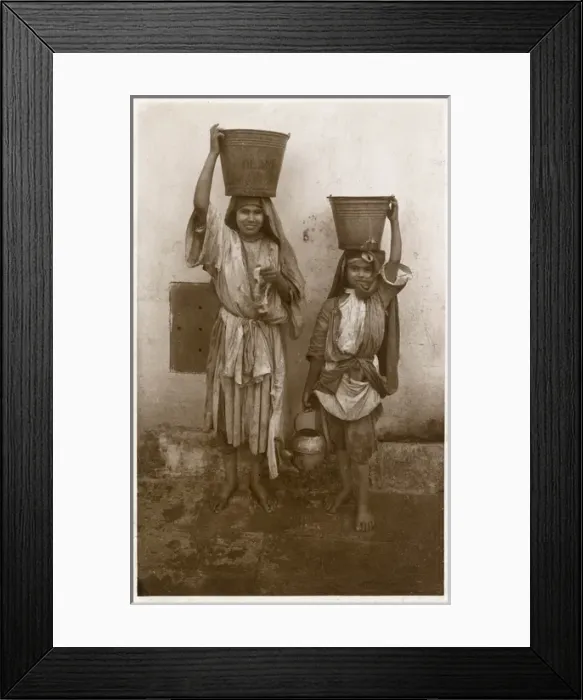 Framed Print : Two young Moroccan Girls with buckets on their heads Framed Print : Two young Moroccan Girls with buckets on their heads