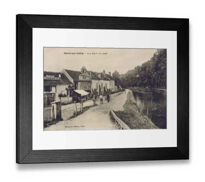 Framed Print : Moret-sur-Loing - Houses and a Wine Shop on the Canal Framed Print : Moret-sur-Loing - Houses and a Wine Shop on the Canal