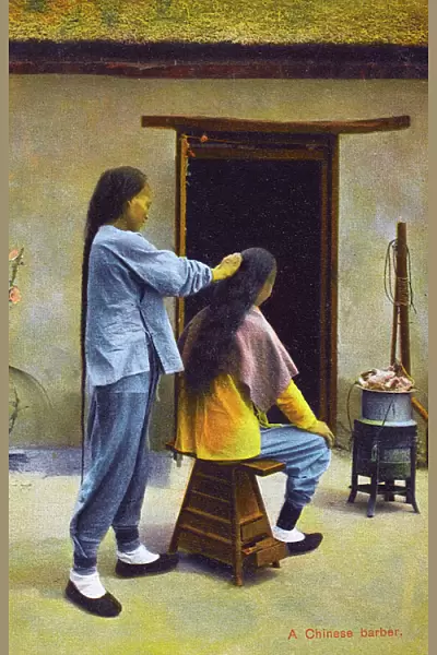 China - A Chinese Barber, preparing a long pigtail