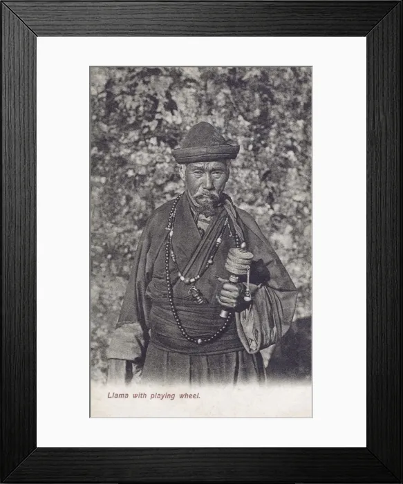 Framed Print : Buddhist Tibetan Lama holding a prayer wheel